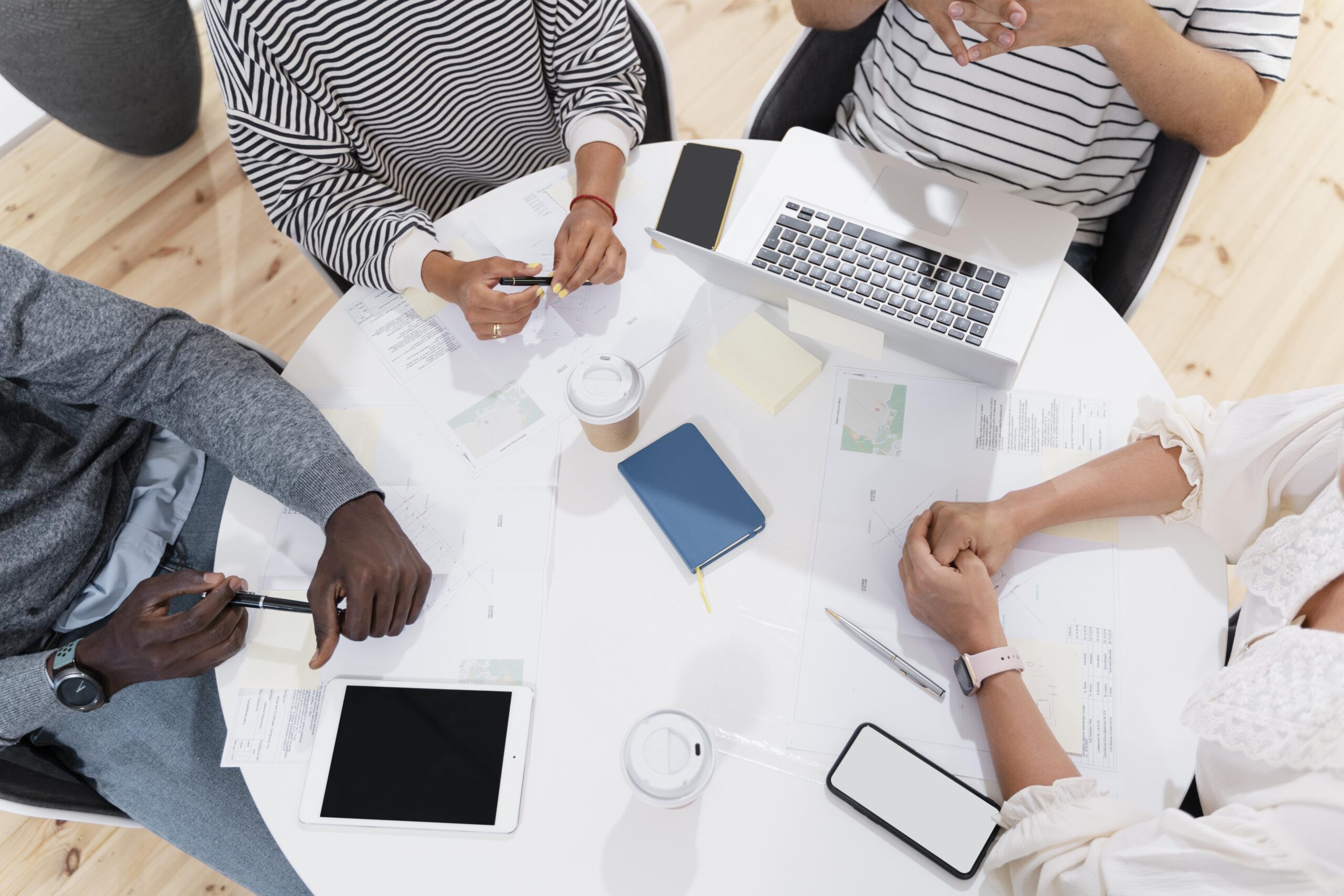 close-up-young-colleagues-hands-meeting